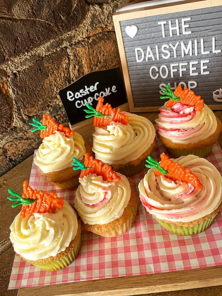 Cupcakes decorated with small orange carrots